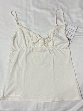 Brandy Melville white Amara babydoll tank w/ bow tie